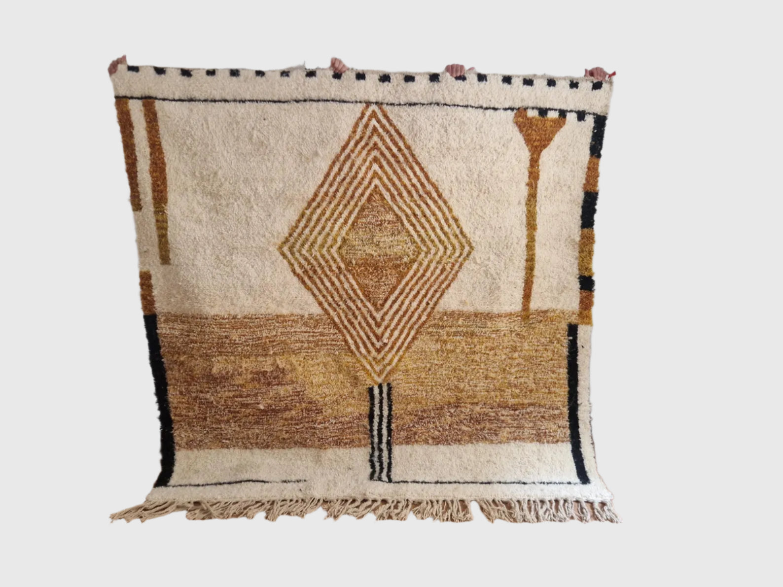 Handmade Moroccan wool rug with central diamond and earth-tone geometric design