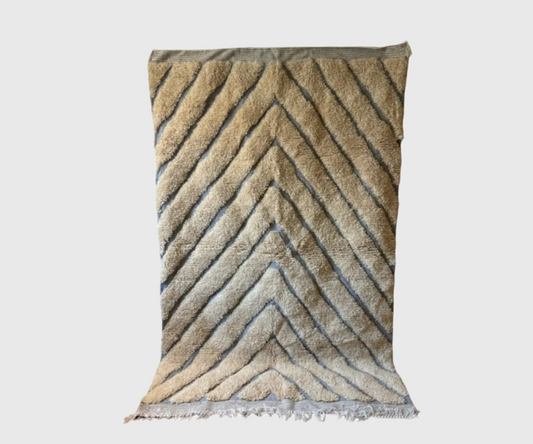 Beige Moroccan rug with soft chevron pattern in dark tones. Perfect for adding texture and warmth to living rooms, bedrooms, or neutral interiors.
