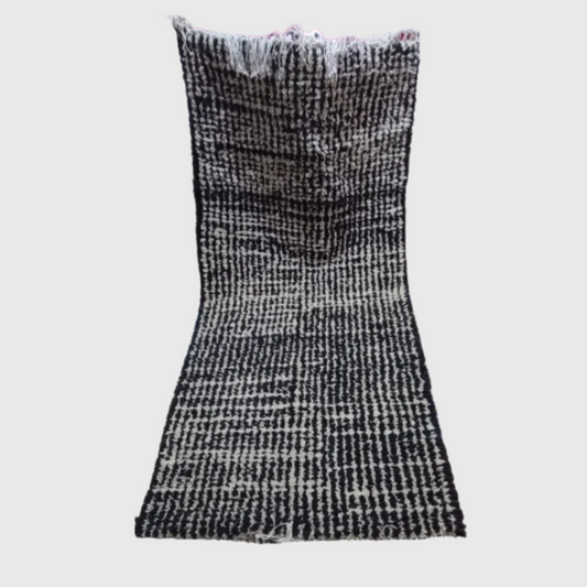 Contemporary monochrome runner rug with a pixelated glitch pattern in black and off-white tones. Ideal for modern hallways or minimalist interiors.