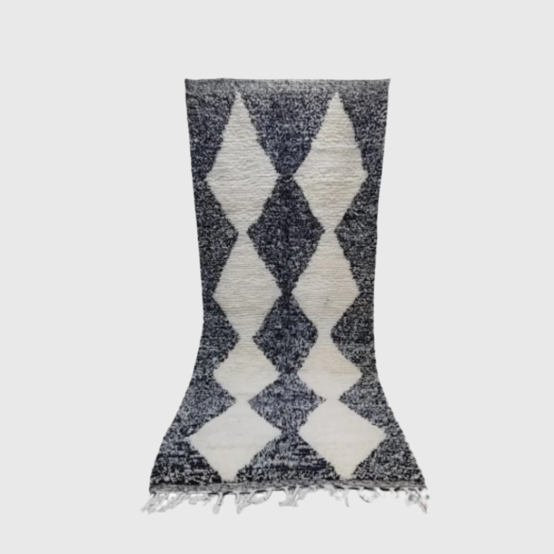 Black and white wool runner rug with a bold harlequin diamond pattern, perfect for hallways or entryways.