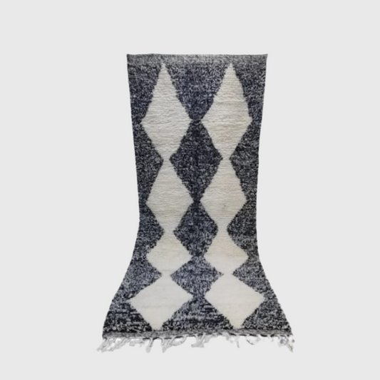 Black and white wool runner rug with a bold harlequin diamond pattern, perfect for hallways or entryways.