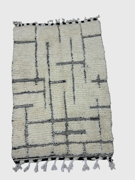 Modern Moroccan rug in cream with black geometric lines, handmade wool, 5x8 feet