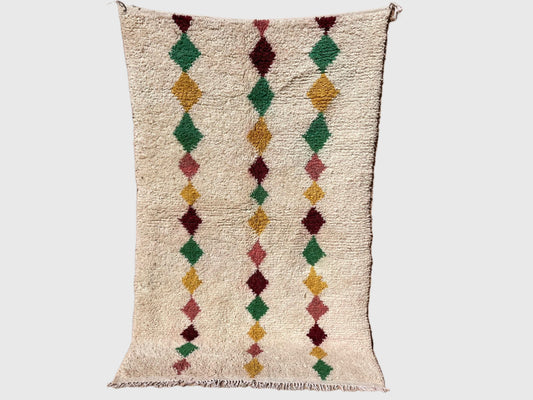 Handmade Moroccan boho wool rug with colorful diamond patterns in green, mustard, and red on a beige background, 5x8 feet