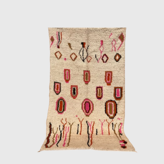 Handmade Moroccan wool boho rug with pink, orange, and black abstract shapes on a beige background, 5x8 feet