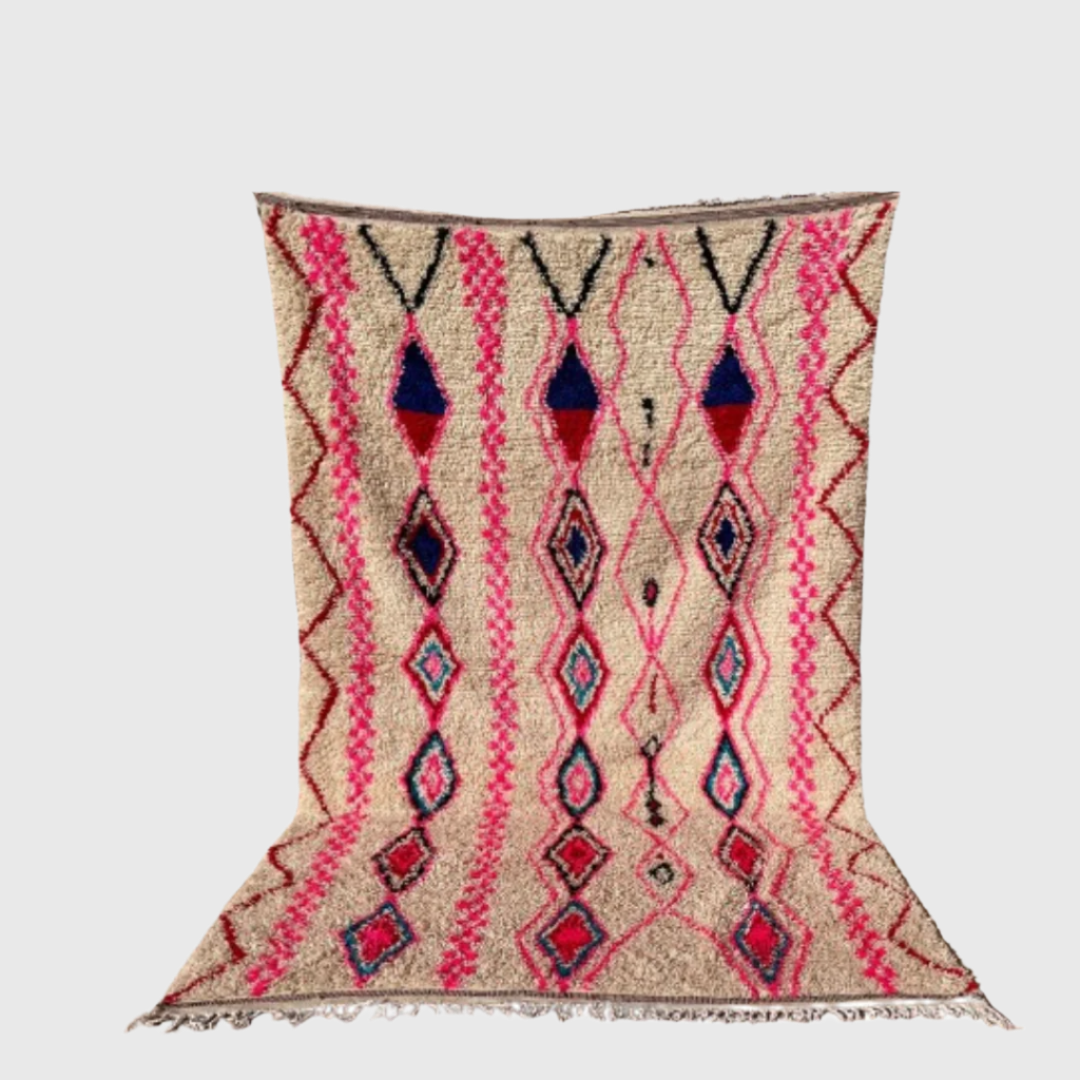 Colorful Moroccan boho rug with pink, blue, and beige diamond pattern on white background