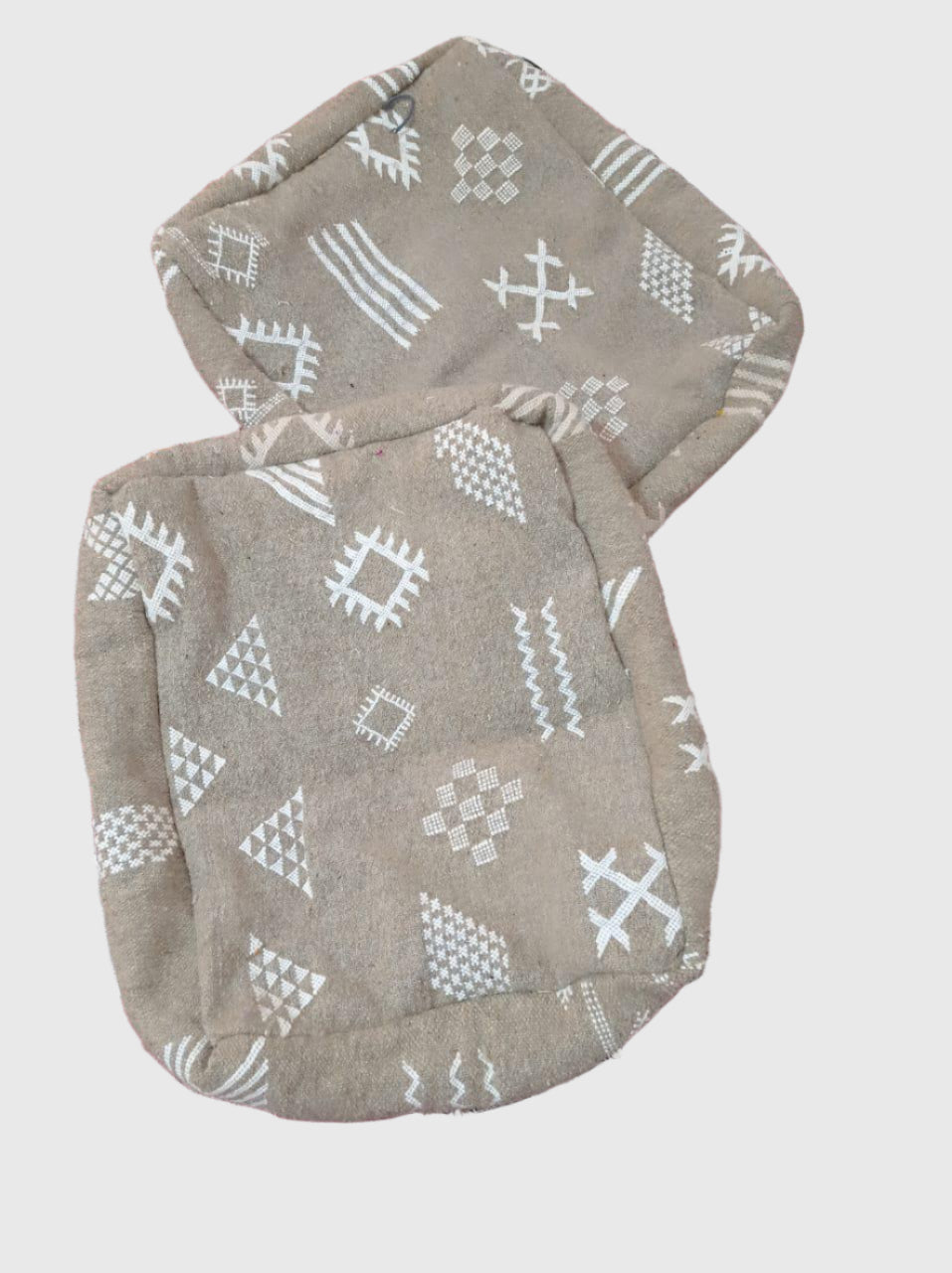 Set of handmade Moroccan pouf covers in grey cotton with white tribal patterns and stitched edges